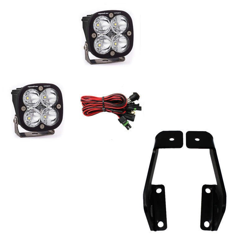 The image features components from the Baja Designs Squadron Sport 2009-2014 Ford F-150 A-Pillar Kit, showcasing two stylish LED light pods, a set of red and black wires with connectors, and two sleek black metal mounting brackets, all beautifully displayed against a white background.