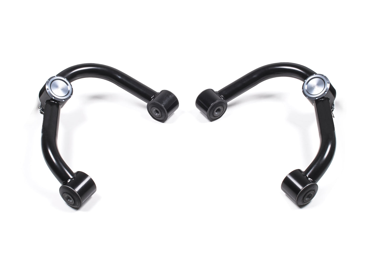 Two black upper control arms from the BDS Upper Control Arm Kit for Chevy Silverado and GMC Sierra 2500HD / 3500HD (11-19) are arranged symmetrically on a white background. Each arm has a curved shape with bushings at both ends and a metal joint on one side. The arms appear clean and new, suggesting they are high-quality replacement parts for the suspension systems of these trucks.